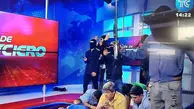 ویدئو: مردان ماسک‌پوش، با قطع برنامه زنده خبرنگاران را گروگان گرفتند